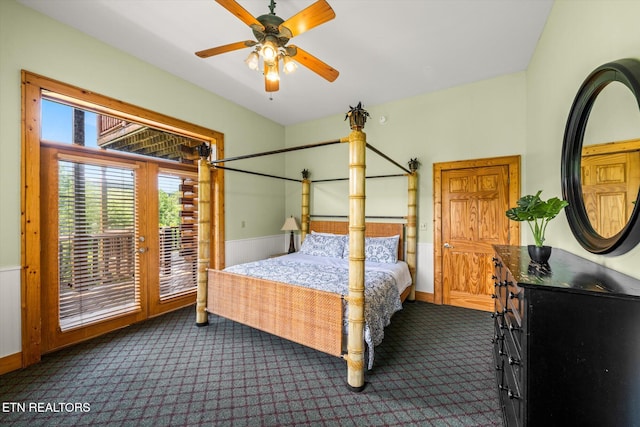 bedroom with access to outside, dark colored carpet, and baseboards