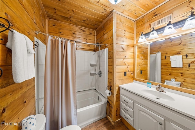 full bath with wood walls, wooden ceiling, shower / bath combo with shower curtain, and vanity