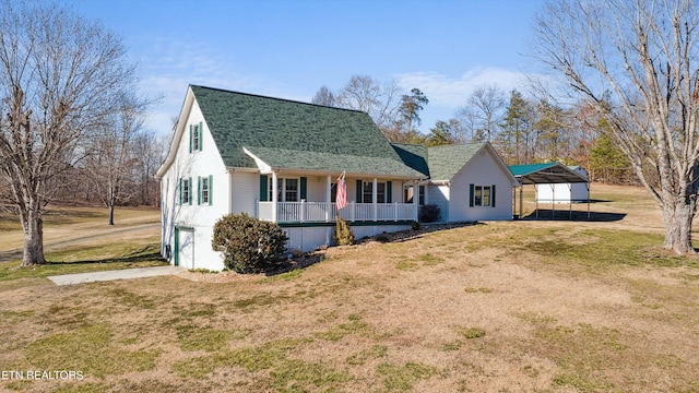 view of front of house with a porch, a shingled roof, a front yard, a garage, and driveway