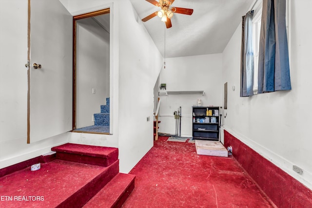 interior space featuring ceiling fan