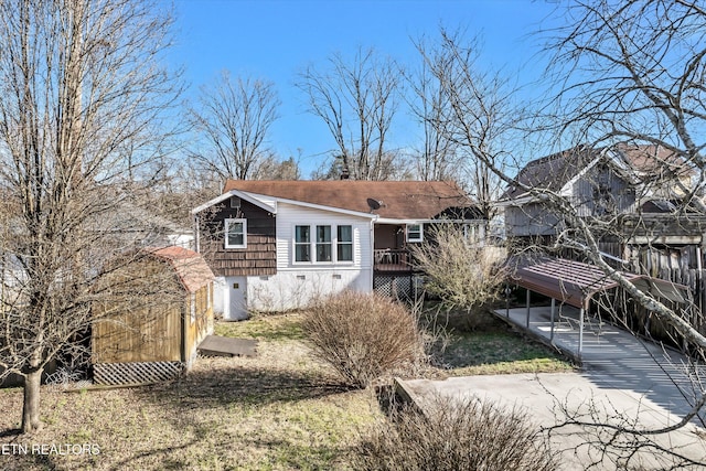 rear view of house with a wooden deck