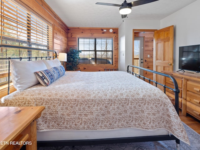 bedroom with a ceiling fan and wood finished floors