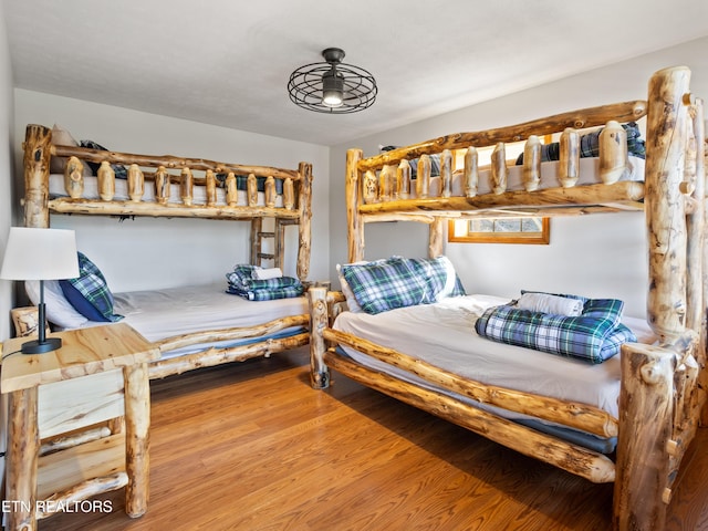 bedroom with wood finished floors