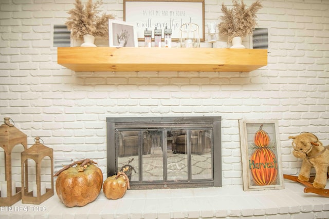 interior details with a fireplace and visible vents