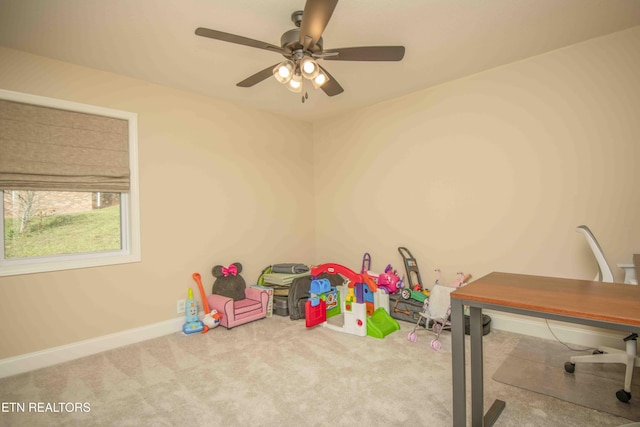 game room with a ceiling fan, carpet, and baseboards