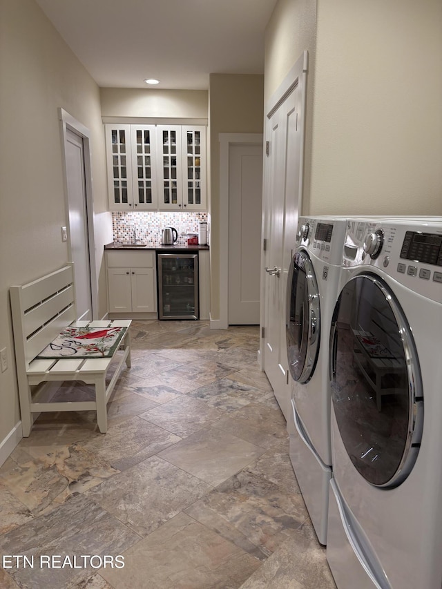 193 Holly Tree Dr, Crossville, TN 38555 - clothes washing area featuring a dry bar, laundry area, beverage cooler, washer and dryer, and a sink