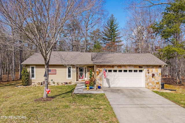 ranch-style house with a shingled roof, concrete driveway, stone siding, an attached garage, and a front yard