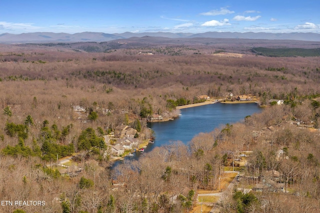 drone / aerial view featuring a water and mountain view