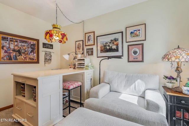 living area with carpet flooring and baseboards