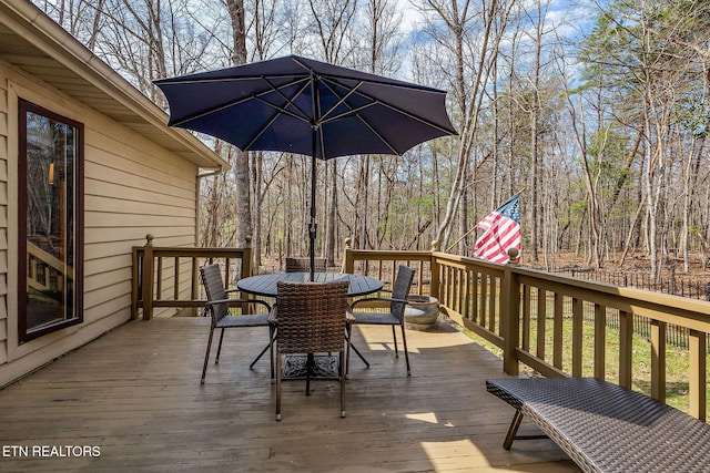 wooden deck with outdoor dining space