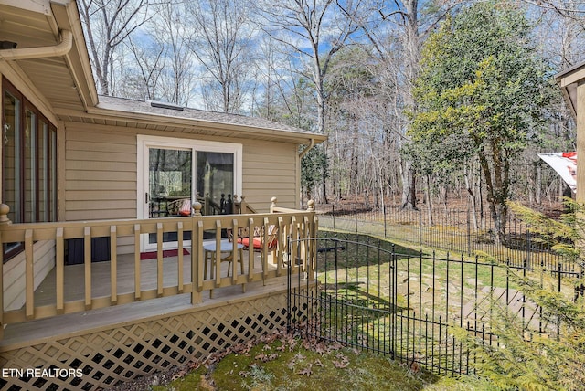 wooden deck featuring fence