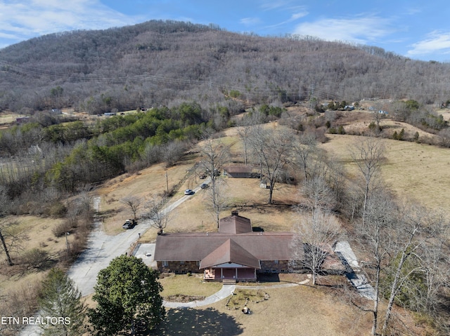 bird's eye view with a mountain view and a forest view