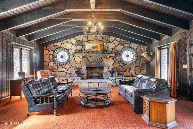 living room with lofted ceiling with beams, a fireplace, wood ceiling, and an inviting chandelier