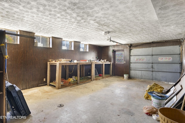 garage featuring wooden walls