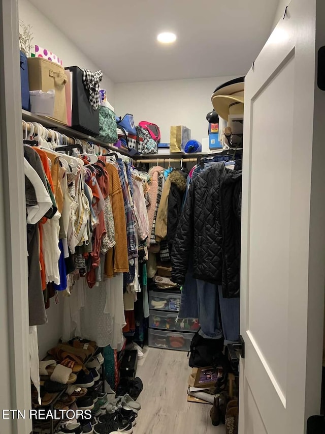 spacious closet featuring wood finished floors