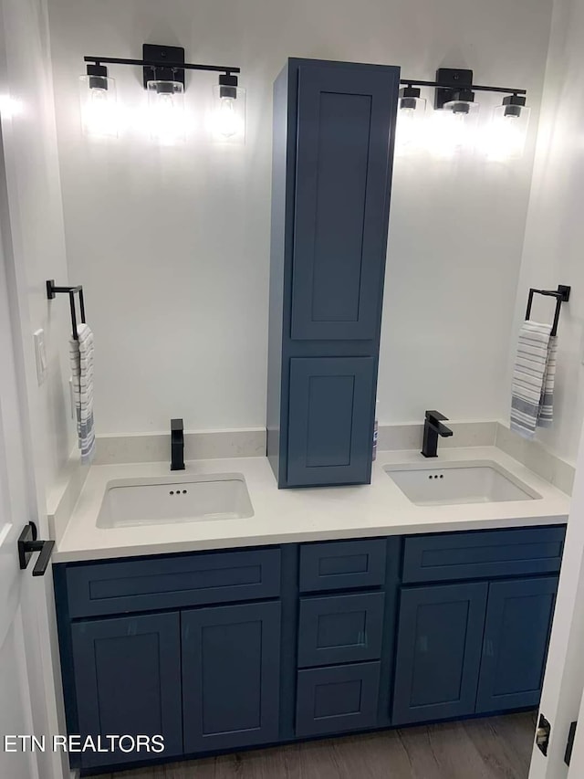 bathroom with double vanity and a sink