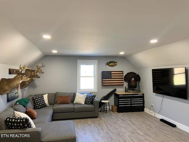 living area featuring recessed lighting, vaulted ceiling, baseboards, and wood finished floors