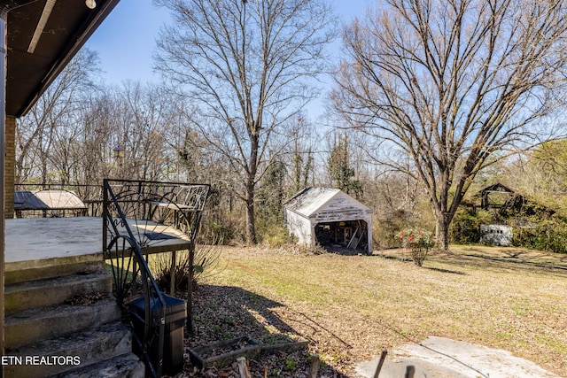 view of yard with an outbuilding and a shed