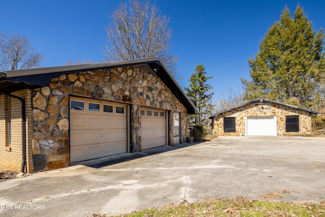 garage featuring driveway