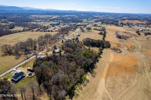 drone / aerial view with a mountain view and a rural view