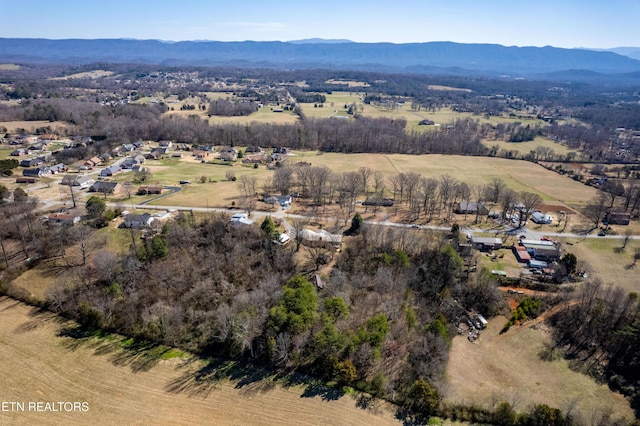 drone / aerial view with a mountain view and a rural view