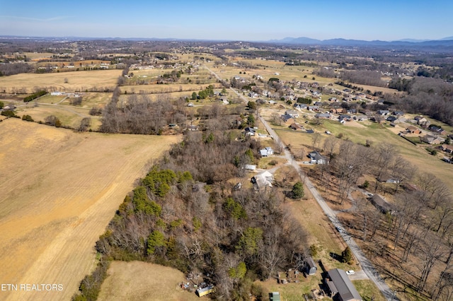 aerial view featuring a rural view and a mountain view