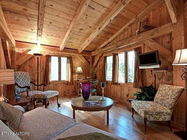360 Spurlock Hollow Ln, Gainesboro, TN 38562 - living area featuring wood ceiling, wood walls, lofted ceiling with beams, and wood finished floors
