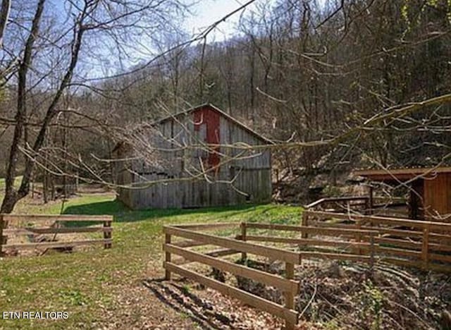 360 Spurlock Hollow Ln, Gainesboro, TN 38562 - view of yard featuring an outbuilding and fence