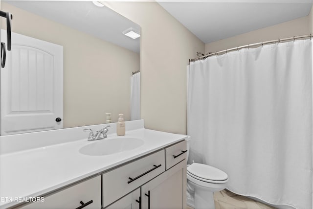 full bathroom featuring toilet and vanity