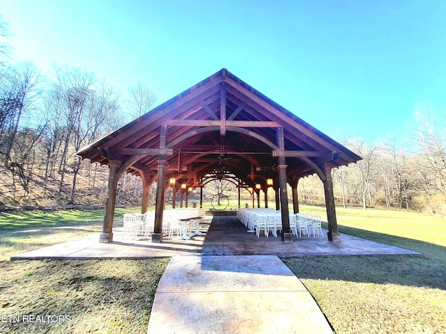 view of community with a lawn and a gazebo