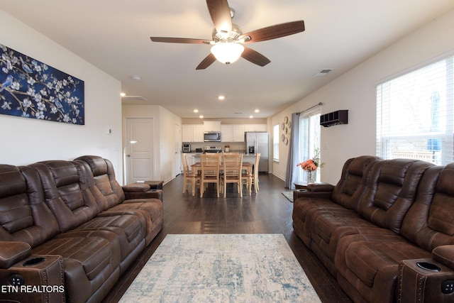 living area with ceiling fan, dark wood-type flooring, and recessed lighting