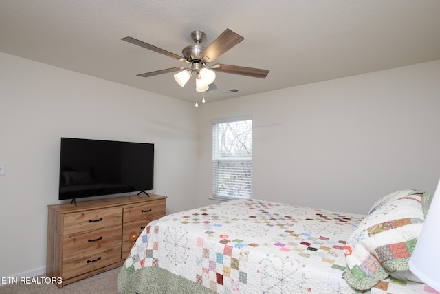 bedroom with carpet floors and a ceiling fan