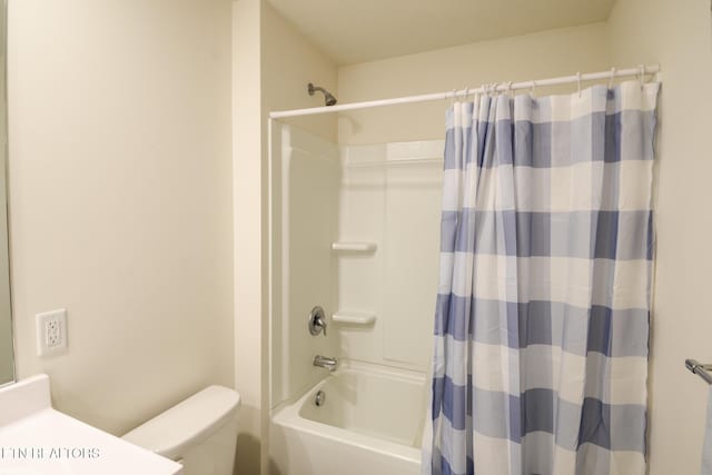 bathroom featuring shower / bath combo, vanity, and toilet