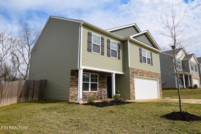 view of front of home featuring a front yard, concrete driveway, fence, and an attached garage