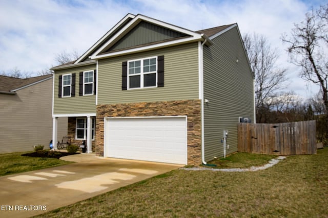 view of front of house featuring driveway, a front lawn, an attached garage, and fence