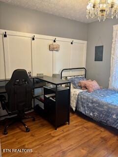 215 Vann Dr, Harriman, TN 37748 - bedroom with a chandelier and wood finished floors