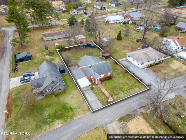 birds eye view of property with a residential view