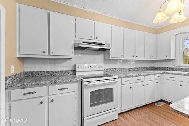 kitchen with white range with electric cooktop, light countertops, light wood-type flooring, under cabinet range hood, and backsplash