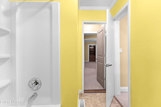 full bathroom featuring baseboards, visible vents, shower / washtub combination, and crown molding