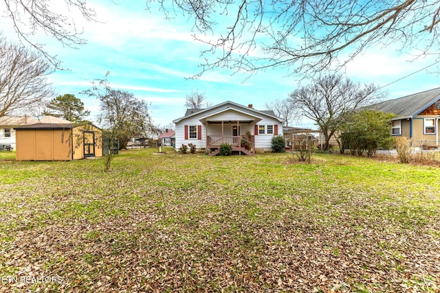 exterior space featuring an outbuilding, a yard, a chimney, a porch, and a storage shed