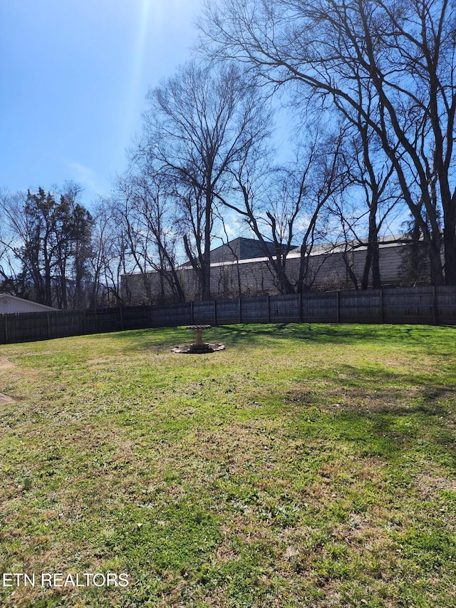 view of yard with a fenced backyard