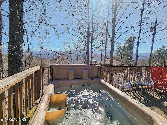 wooden terrace featuring a jacuzzi