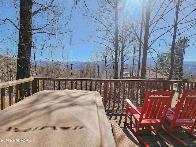 wooden terrace featuring grilling area