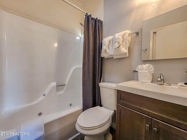 full bathroom with shower / tub combo, a textured wall, vanity, and toilet