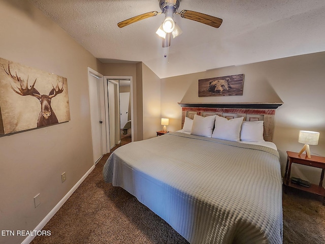 carpeted bedroom featuring a ceiling fan, a closet, a textured ceiling, and baseboards