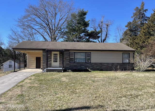 view of front of home with a front lawn, a carport, stone siding, and driveway