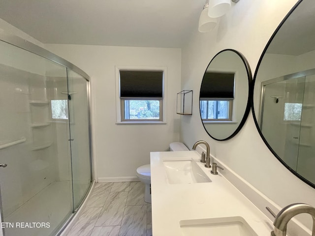 full bathroom with a shower stall, toilet, marble finish floor, and a sink