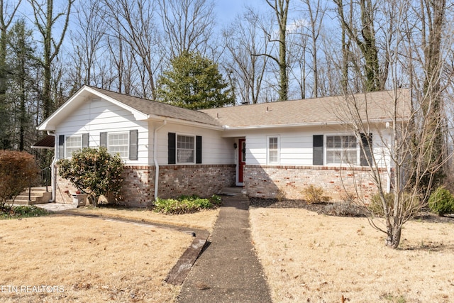 single story home with brick siding