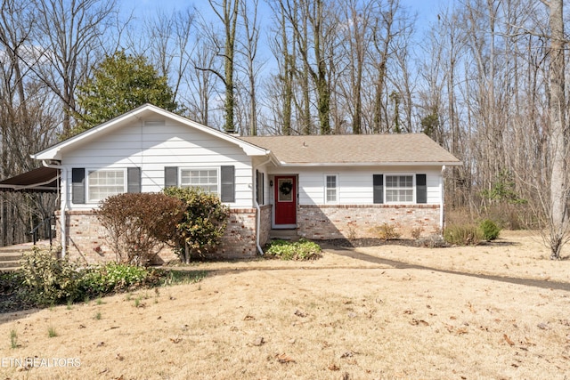 ranch-style home featuring brick siding