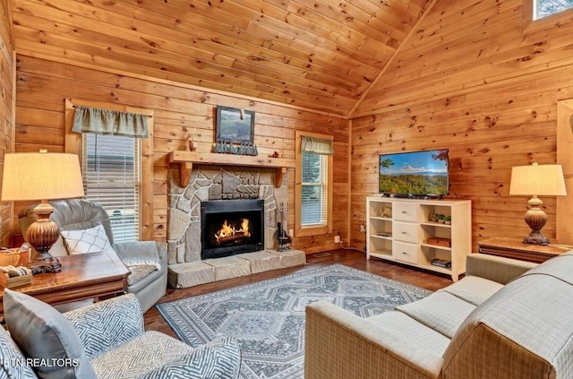 living room with high vaulted ceiling, wooden ceiling, wooden walls, a fireplace, and wood finished floors